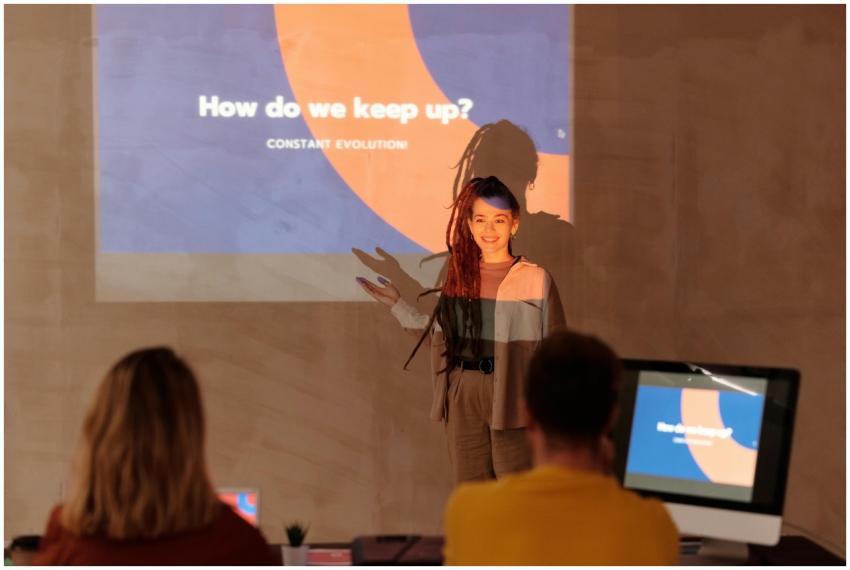 Business meeting featuring a presenter with a proj