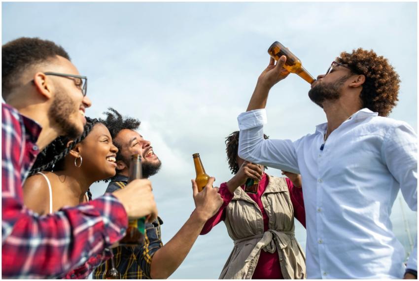 A joyful group of friends having fun and drinking