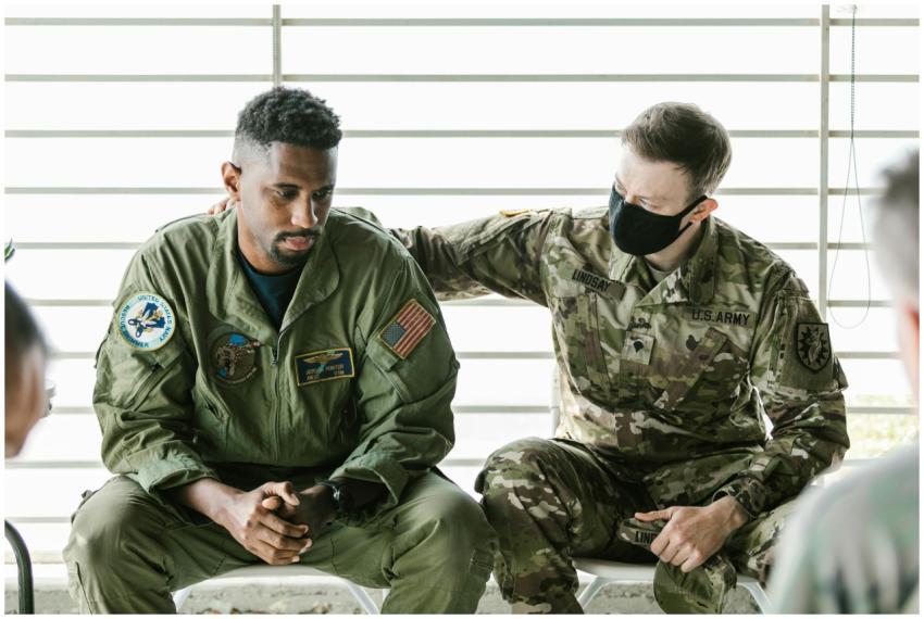 Two military personnel engaged in an emotional sup