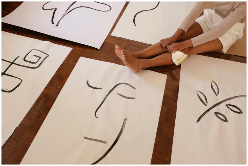 From above of faceless barefoot casually dressed w