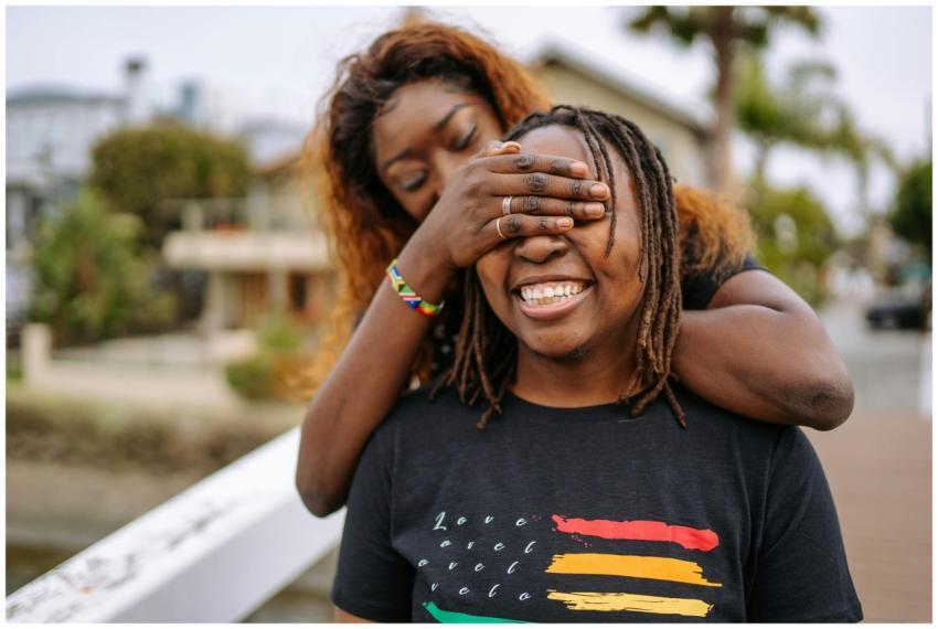 Heartfelt moment of a joyful LGBTQ couple embracin