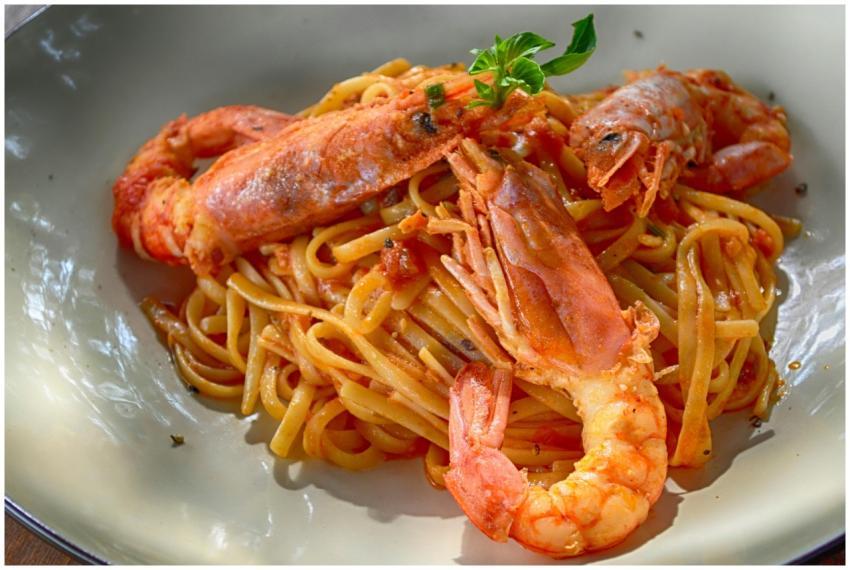 Close-up of a flavorful seafood pasta dish with ki
