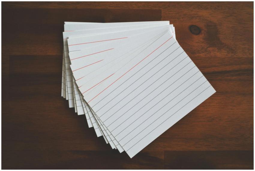 High-angle view of blank index cards arranged neat