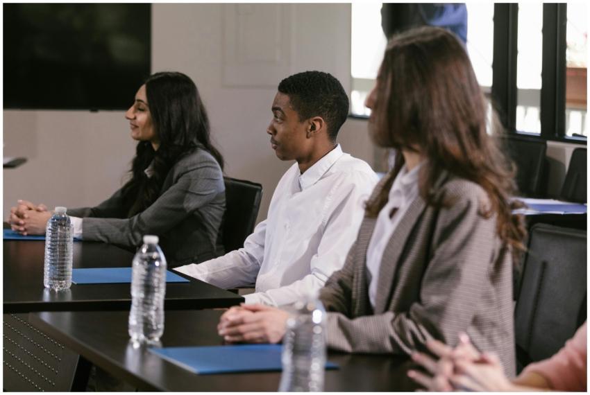 Diverse professionals attending a meeting in a mod