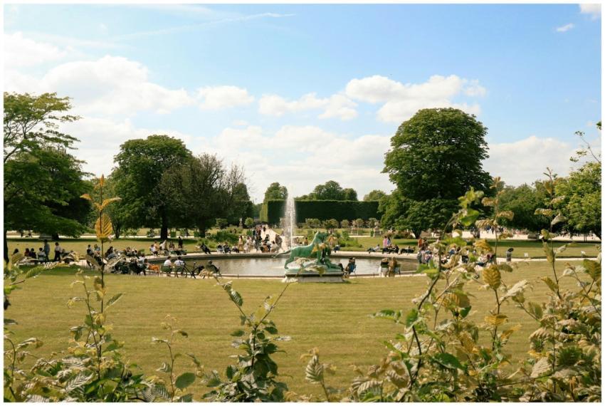 Relaxing scene at Luxembourg Gardens with people e