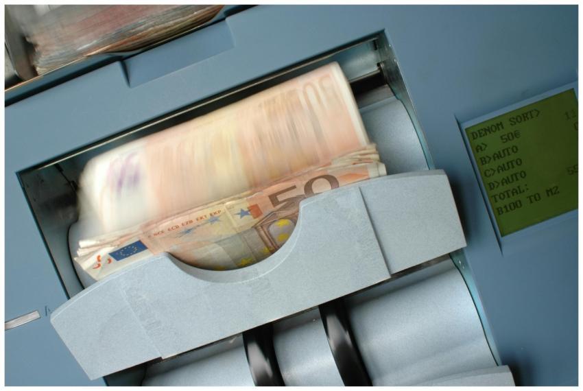 50 Euro banknotes being processed in a high-speed
