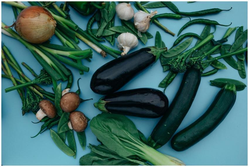 An overhead view of assorted fresh vegetables incl