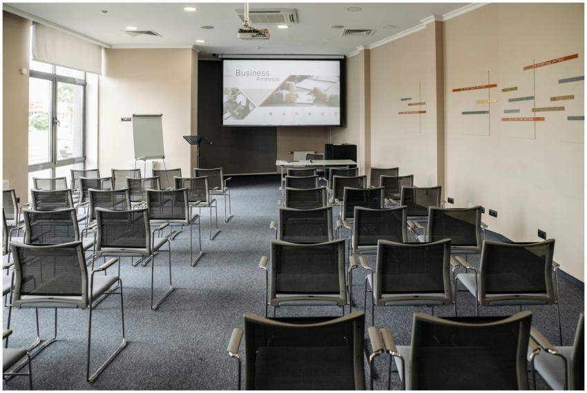 Empty conference room with chairs and a presentati