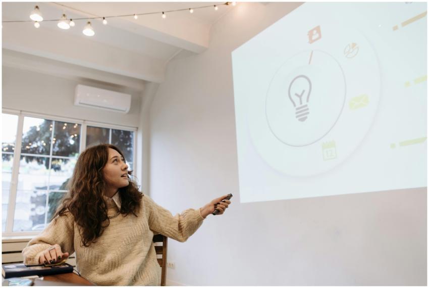Young woman giving a business presentation, pointi