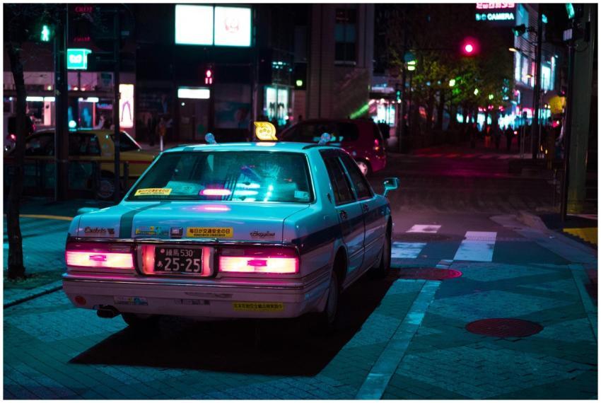 A vibrant Tokyo street at night featuring an illum