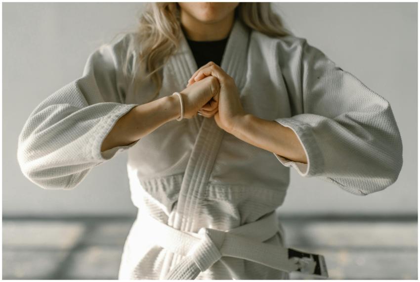 Close-up of a karate practitioner in white gi perf