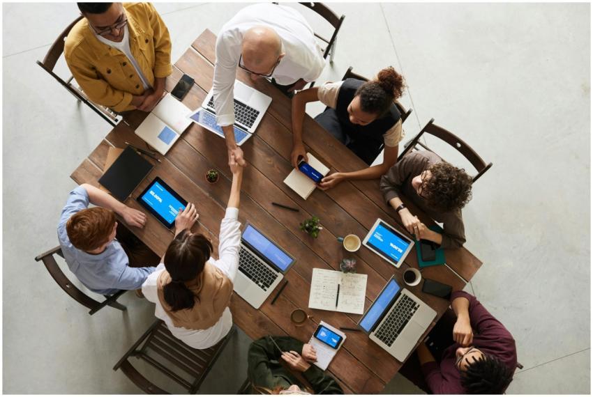 Top view of a diverse team collaborating in an off