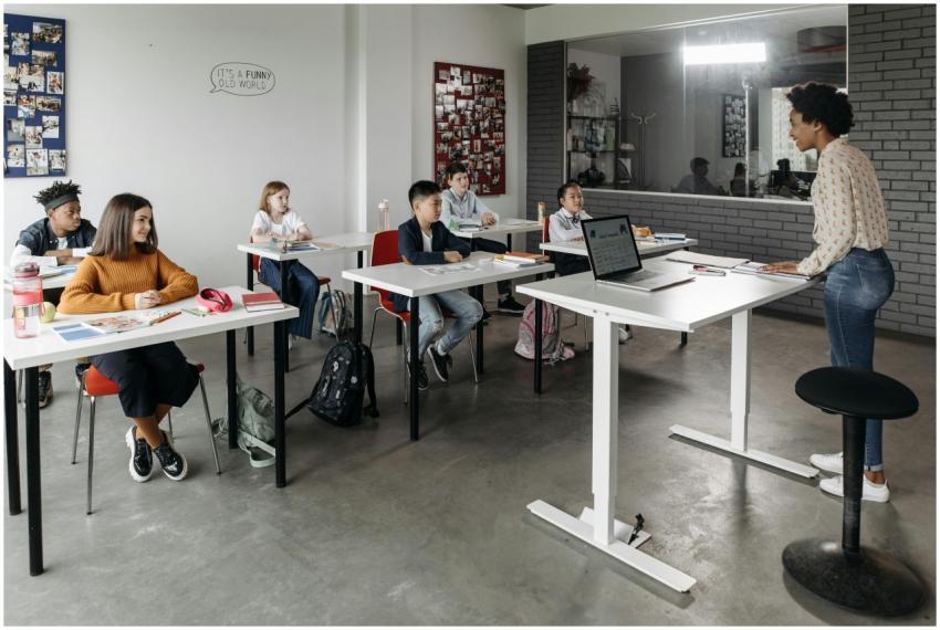 A diverse group of students attentively listens to