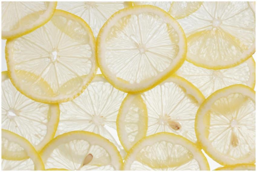Vibrant close-up of fresh lemon slices arranged on