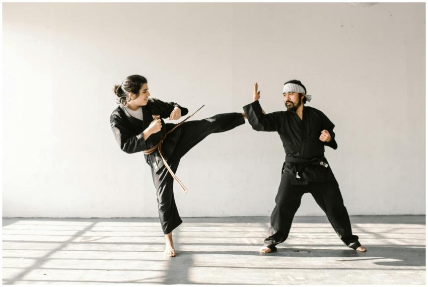 Martial artists practicing dynamic techniques in a