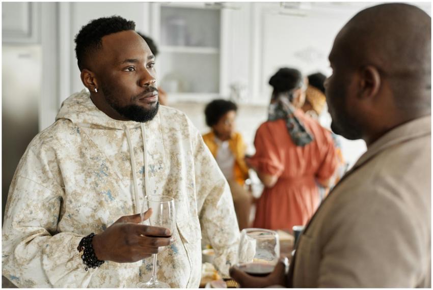 Two friends having a discussion at a casual indoor