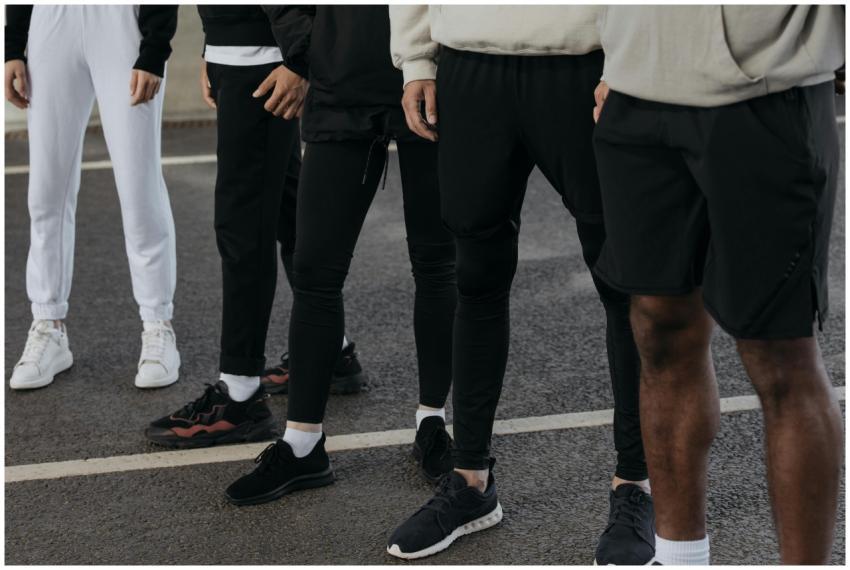 A diverse group of people in activewear standing o