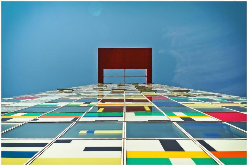 Low angle view of a colorful skyscraper facade wit