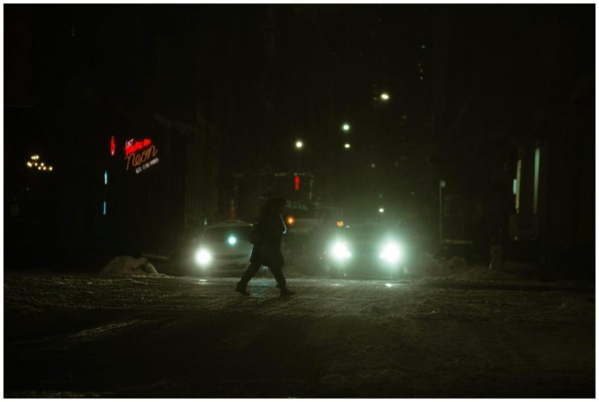 Side view of distant anonymous person crossing sno