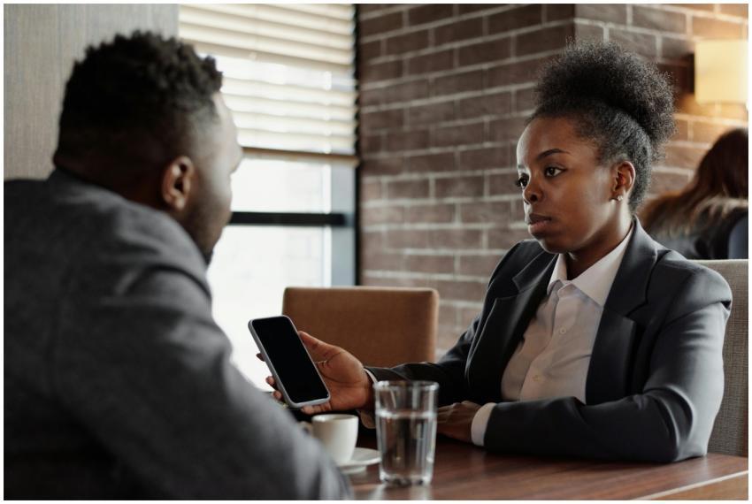 Two business professionals engage in a serious con