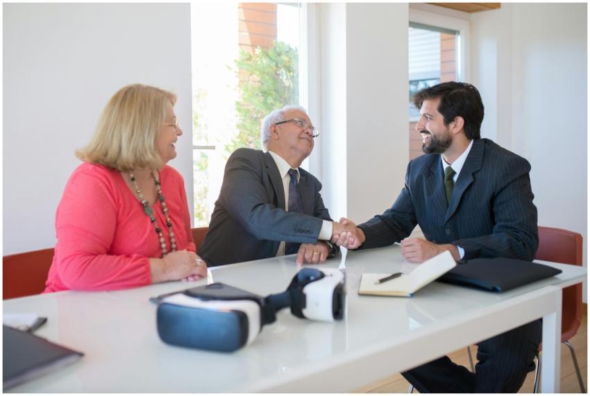 Business professionals engaged in a friendly hands