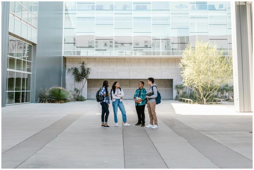 A group of diverse college students standing and t