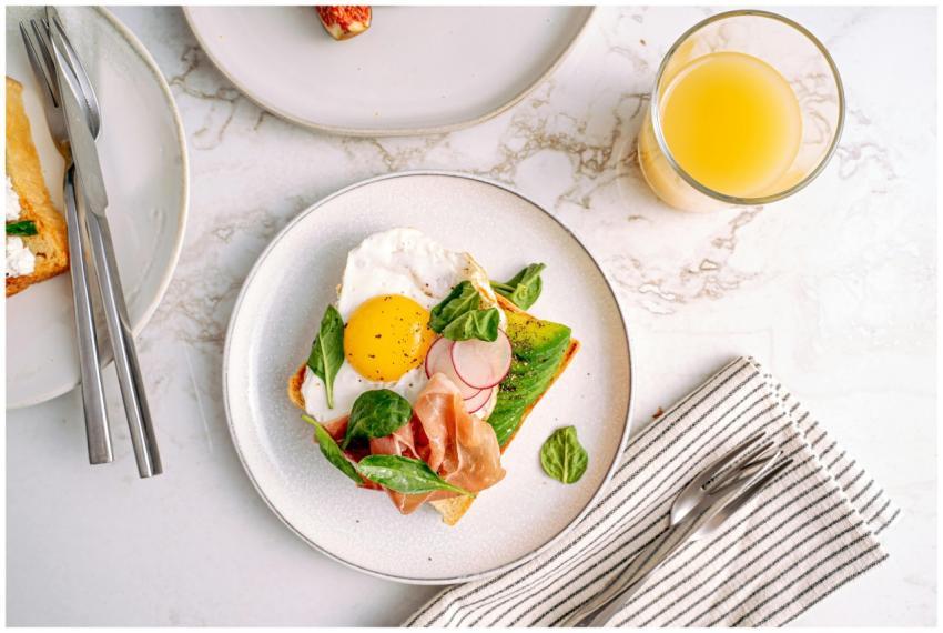 Delicious breakfast featuring avocado toast with e