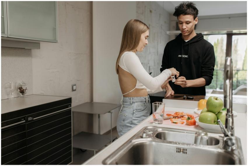 A couple preparing food at home, enjoying time tog