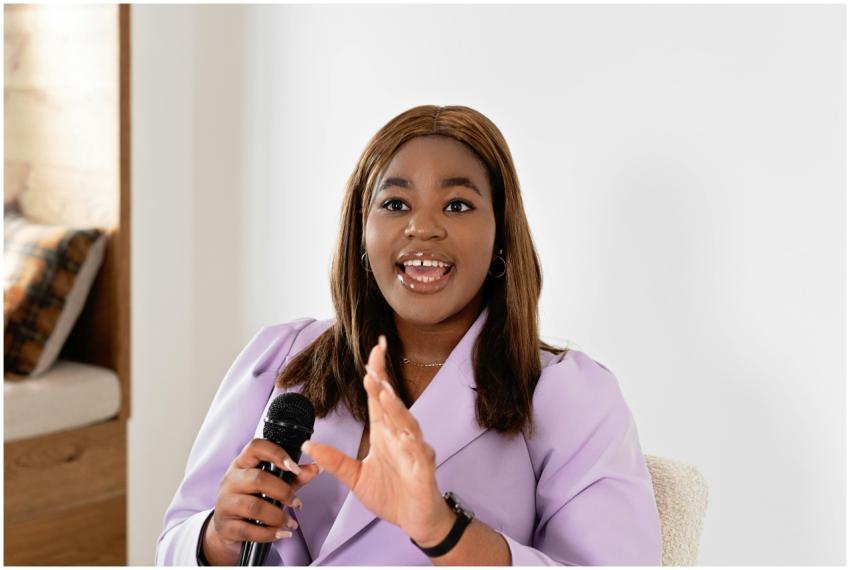 Professional woman in business attire giving an in