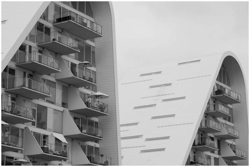 Futuristic curved residential building with glass