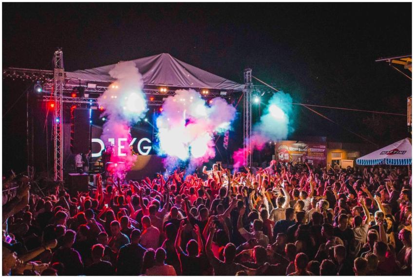 Lively outdoor music festival with vibrant lights,