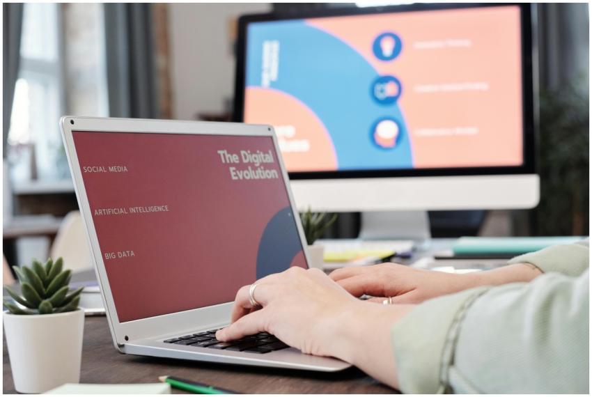 Laptop user typing with digital evolution concept