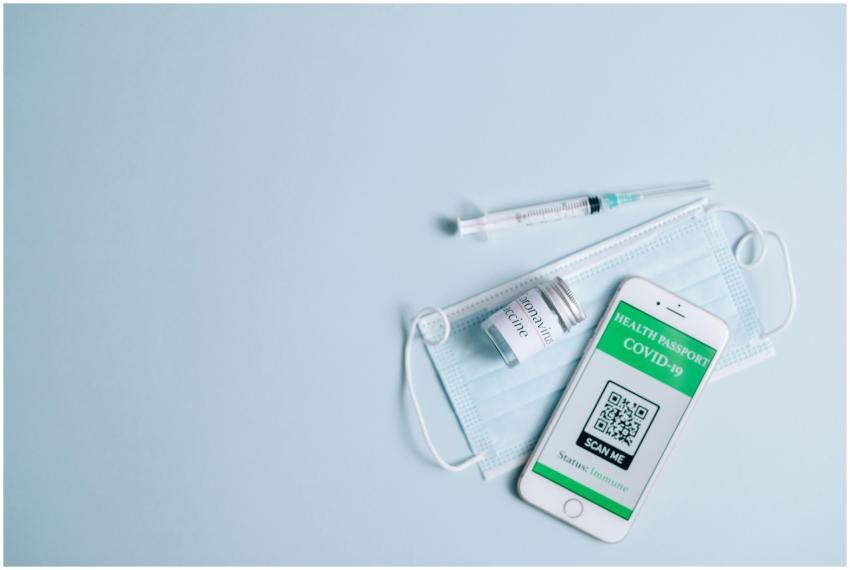 Top view of Covid-19 health passport on smartphone