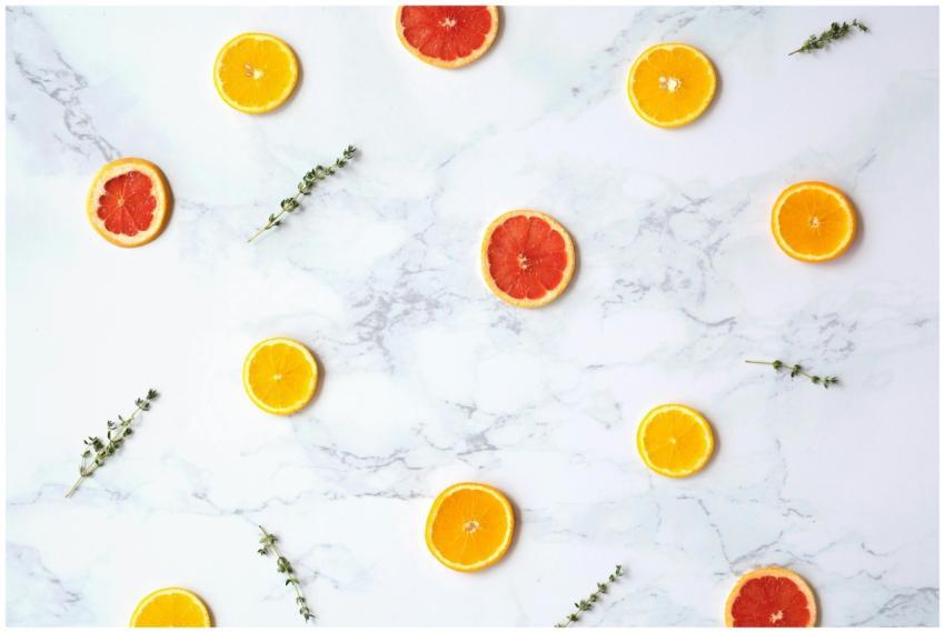 Artistic flatlay of orange and grapefruit slices o