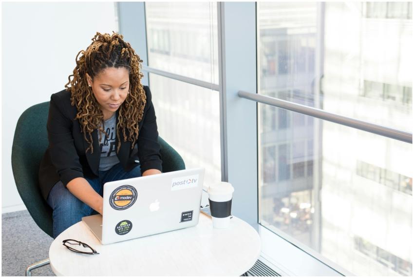 African American woman working on laptop in a mode