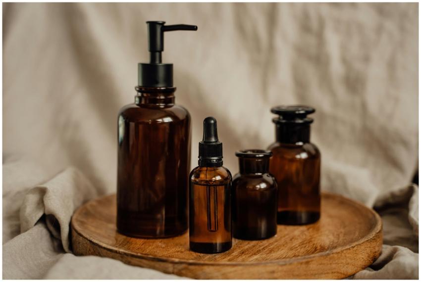 A collection of brown glass cosmetic bottles with