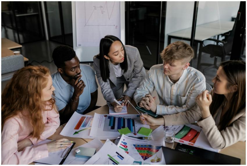 Diverse group of colleagues brainstorming and disc