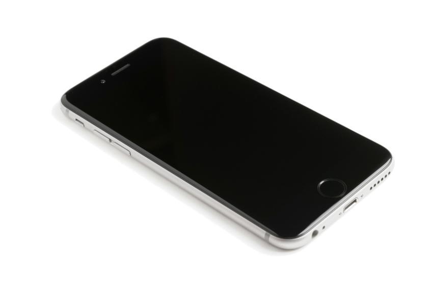 A modern smartphone with a blank screen lying on a