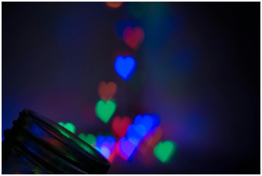 Vibrant heart-shaped bokeh lights in blue, red, an