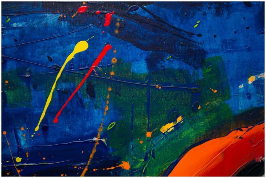 Dynamic abstract painting featuring bold blue, yel