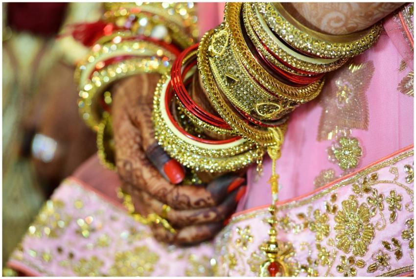 Close-up of a bride's hands adorned with intricate