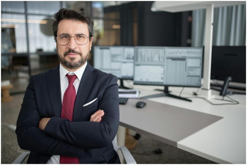 Business professional in corporate attire with arm