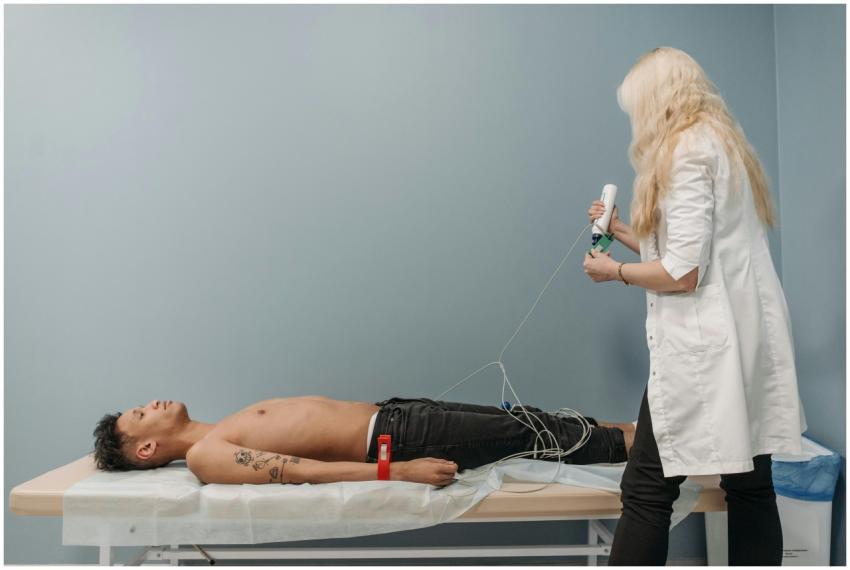 A medical professional examines a patient using di