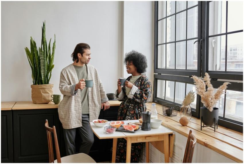 A joyful couple enjoys a morning coffee and health