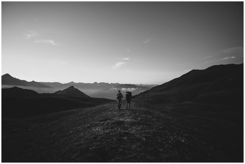 Two hikers enjoy a scenic adventure in the hills o