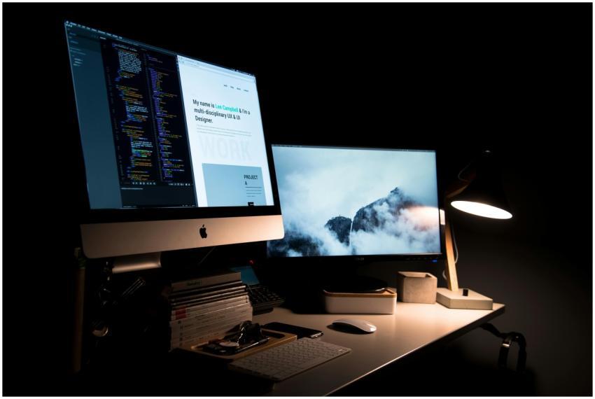 A clean and stylish workspace featuring dual monit