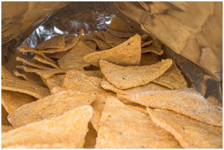 Detailed image of crispy salted corn chips inside