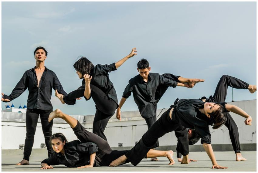 Energetic group performing synchronized martial ar