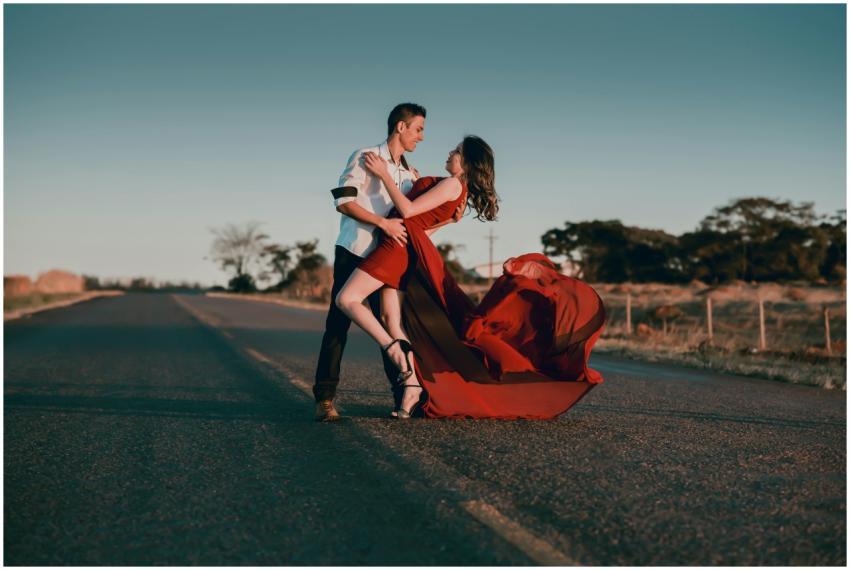 A couple in a passionate dance pose on an empty hi