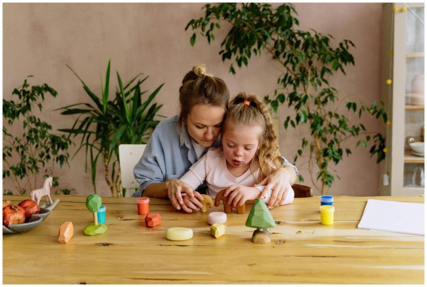 A mother and daughter enjoying creative playtime w